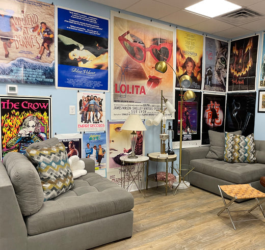 Gallery display of vintage film posters for movies shot in Wilmington, NC at Happiest Kid Finds.