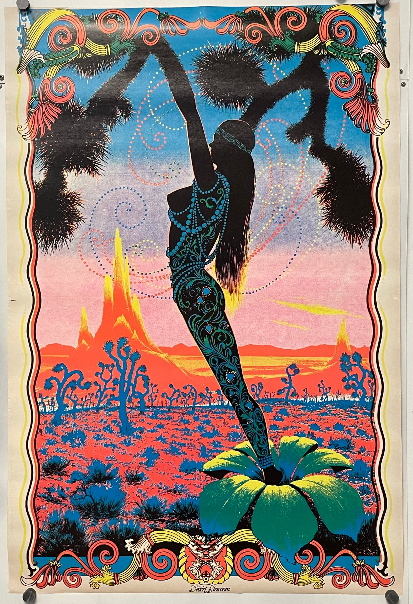 Colorful poster with a silhouette of a dancer against a desert landscape