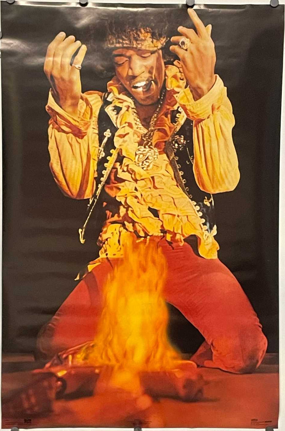 Jimi Hendrix on stage with his burning guitar, vintage commercial poster, 1991