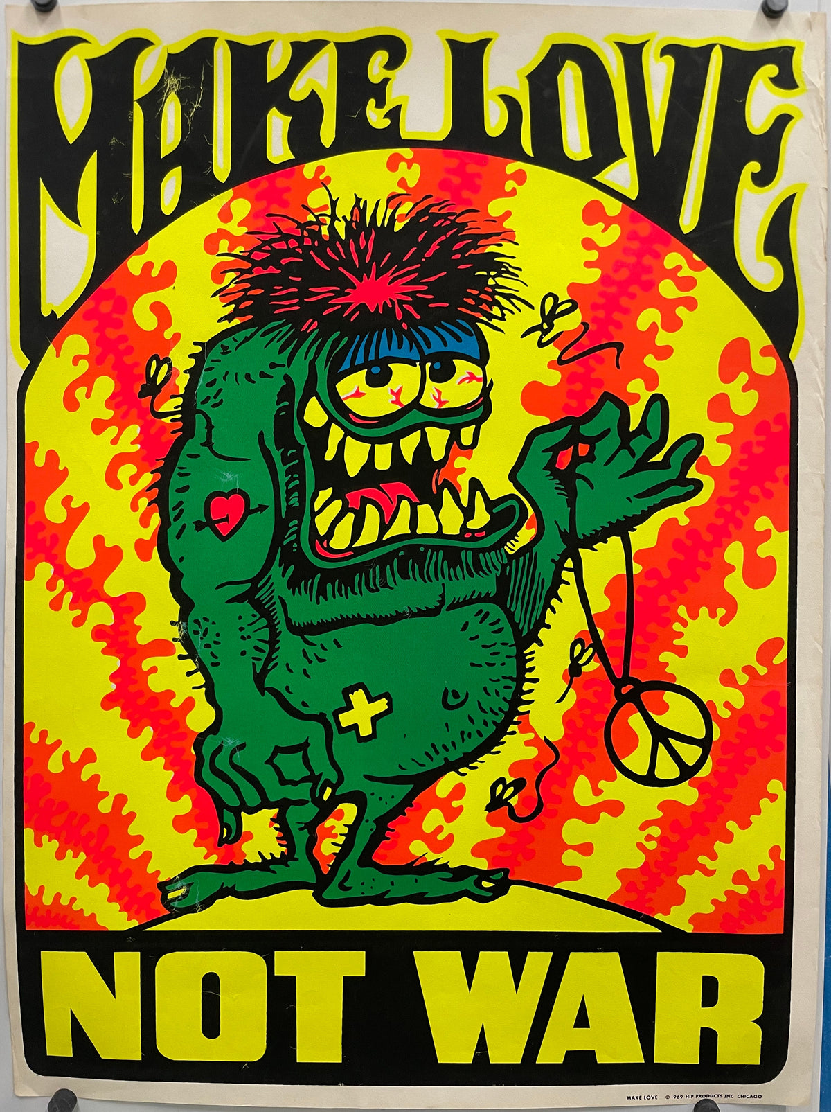 Make Love Not War
rare and vintage screen-printed black light poster. Colorful poster with a green creature on a red and yellow background.