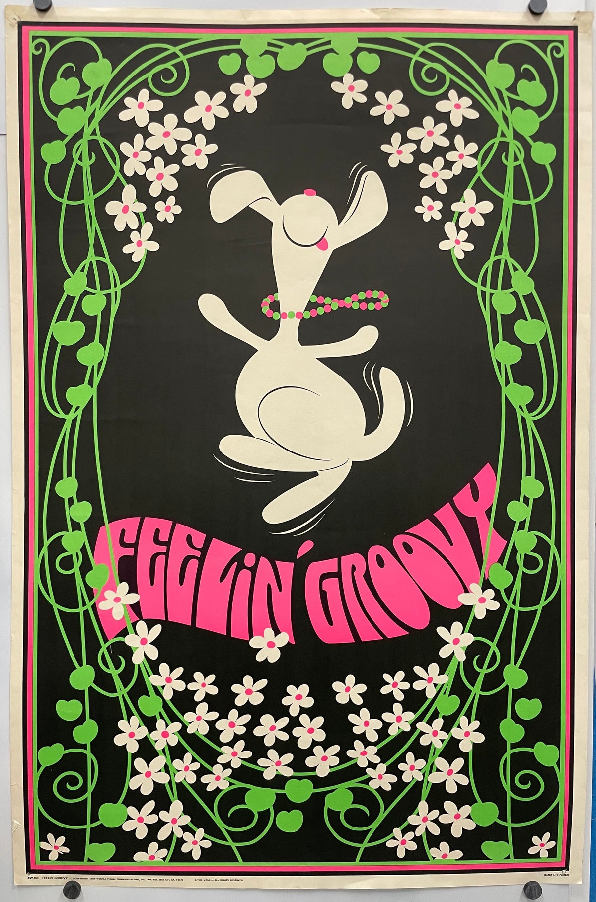 FEELIN' GROOVY ( title across the bottom) fun and lively vintage lithographic commercial poster. Image of a dancing Snoopy wearing a colorful beaded necklace, surrounded by flowers.