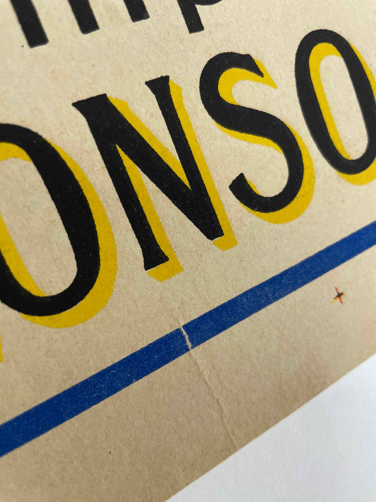 Cognac Quevedo, vintage lithographic Art Deco advertising poster bottom margin detail showing a tear.