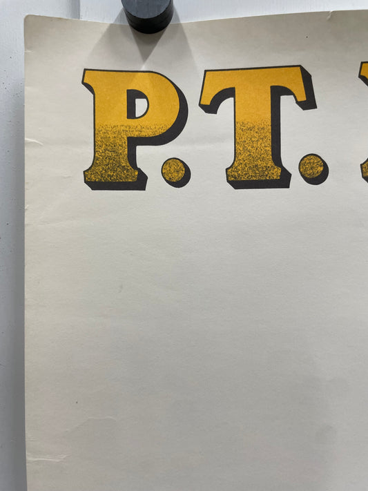 Close-up of a piece of paper with large, yellow letters on a white background