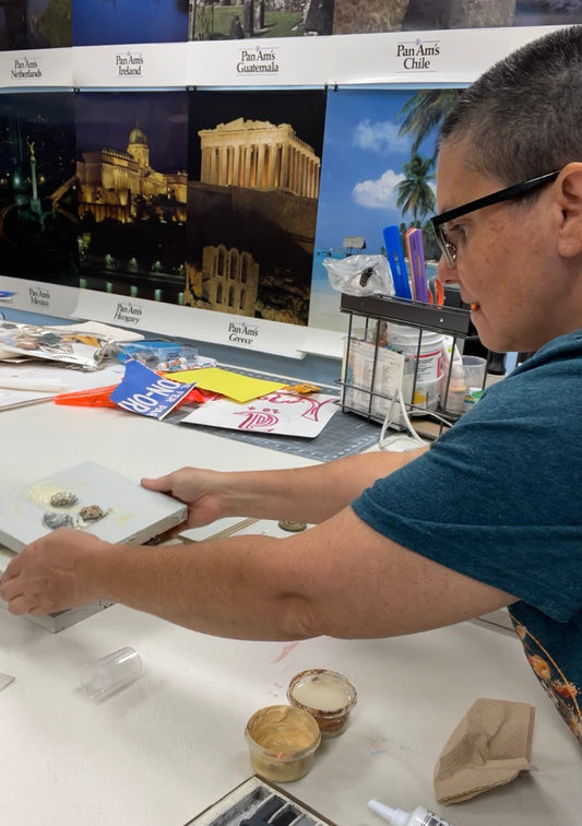 Milagros Melendez, owner of Happiest Kid Finds, is shown here working on Group 2 of the Masonboro Island Reserve series, October 2025.