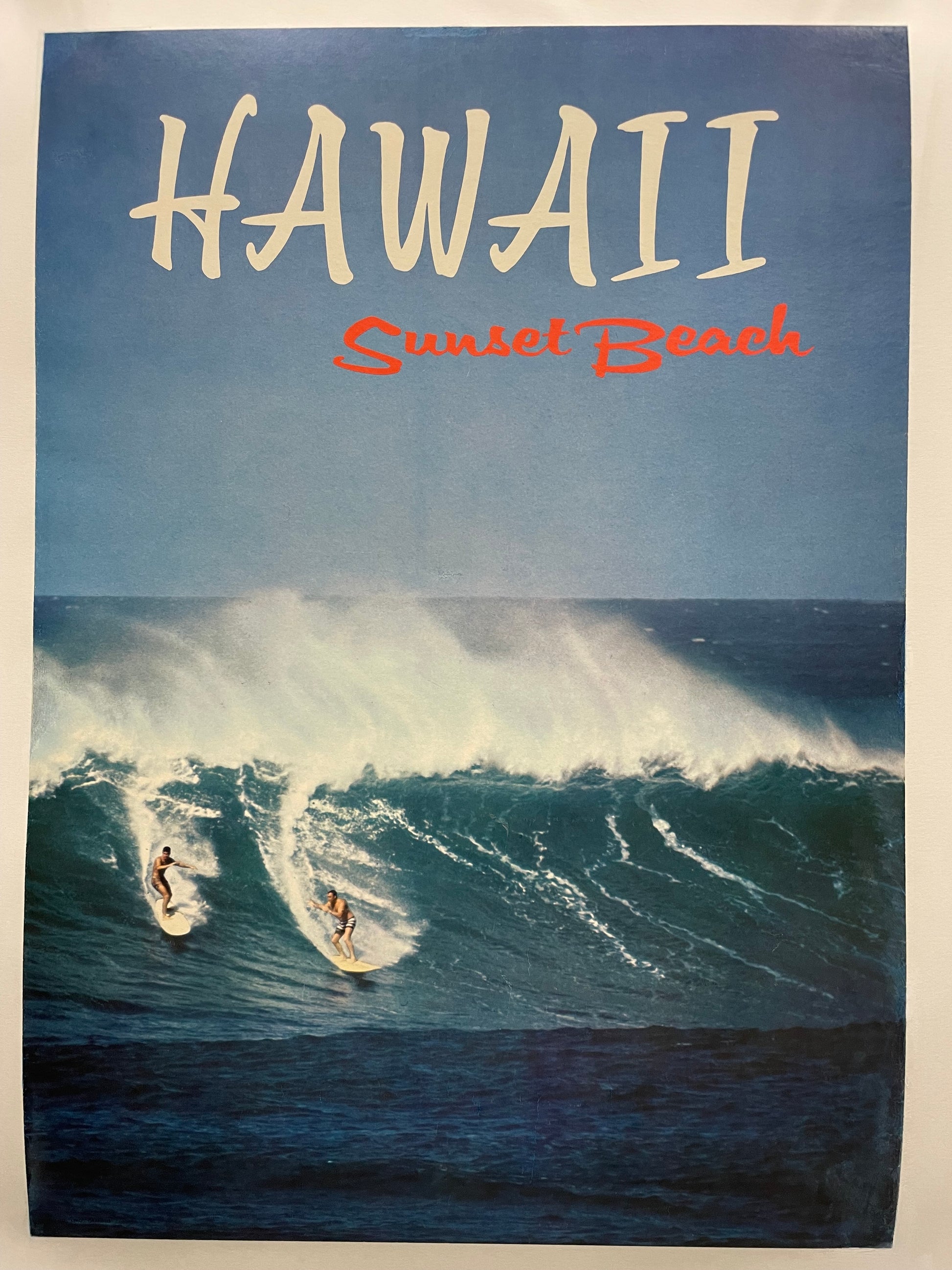 Hawaii - Sunset Beach, vintage offset lithograph travel surfing poster, c.1966. Poster of a surfing scene with 'Hawaii Sunset Beach' text on a blue background