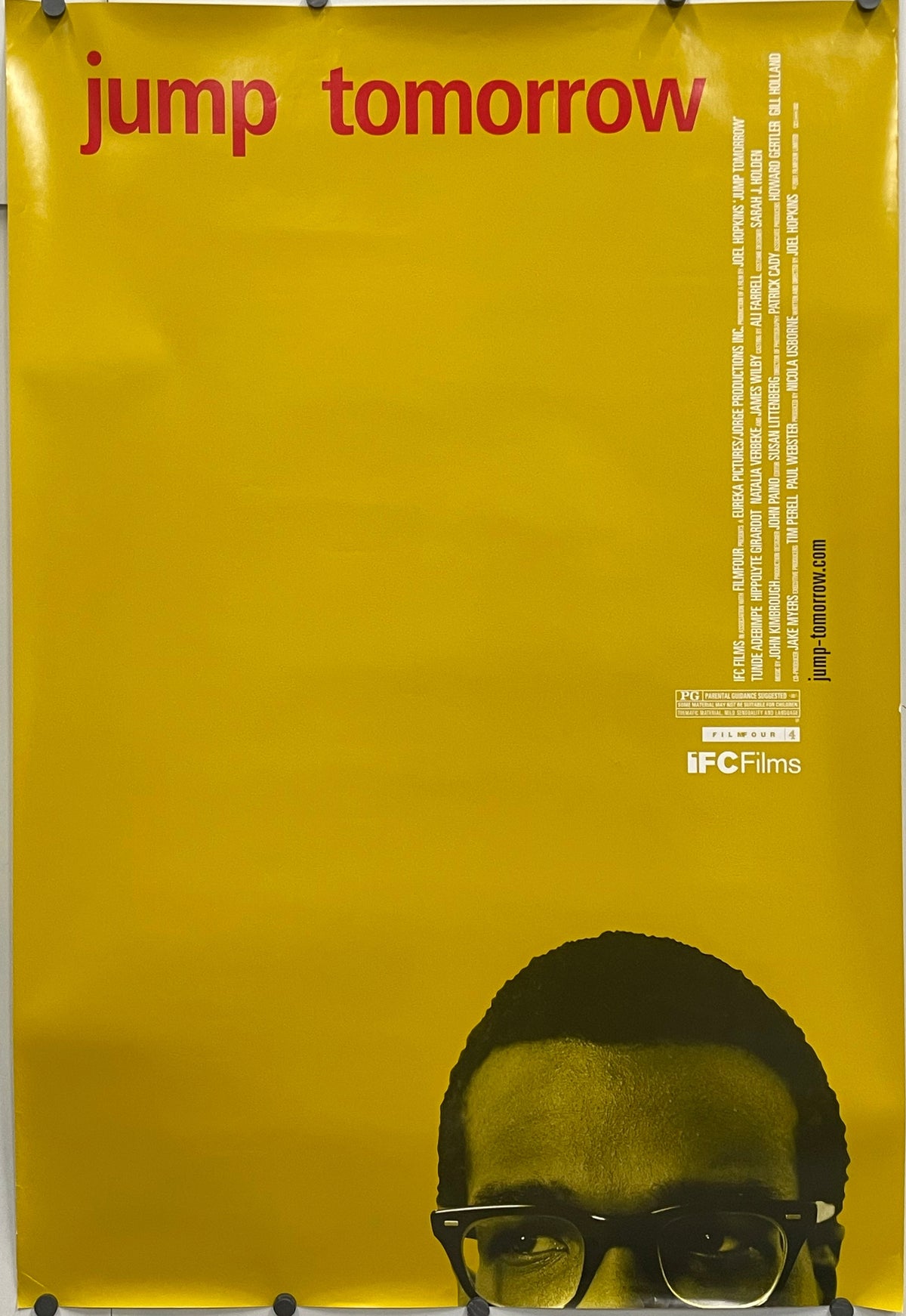 Unusual film poster design, Jump Tomorrow, original rolled US one sheet with a yellow background, 2001. Poster with a yellow background, red text, and a graphic of a person wearing glasses.