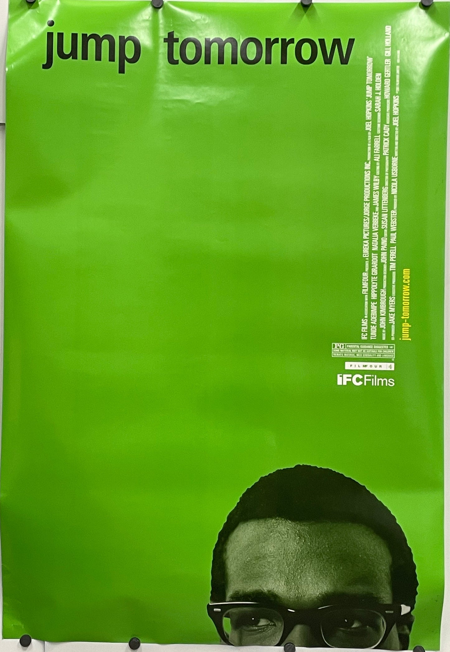 Very cool film poster design, Jump Tomorrow, original rolled US one sheet with a green background, 2001. Image showing the top half of a man's face with glasses and 'jump tomorrow' text against a green background.