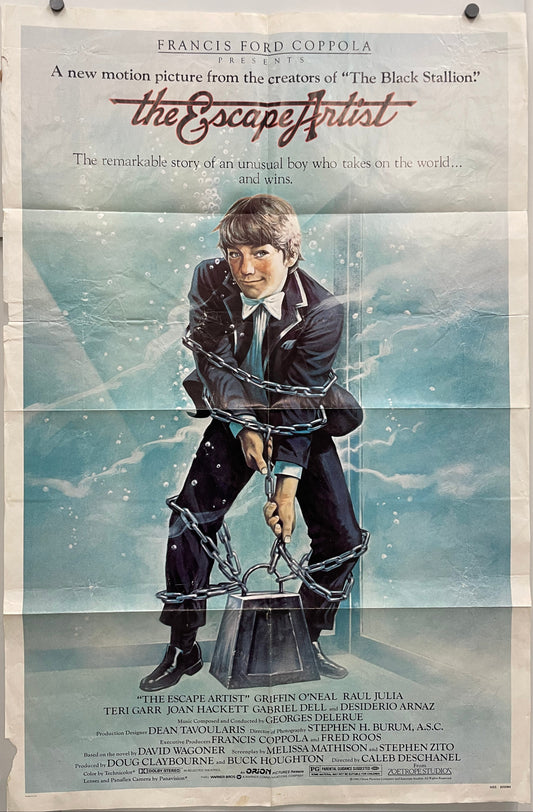 The Escape Artist
vintage and dynamic US one-sheet film poster, image of young man attempting underwater escape while bound in chains.