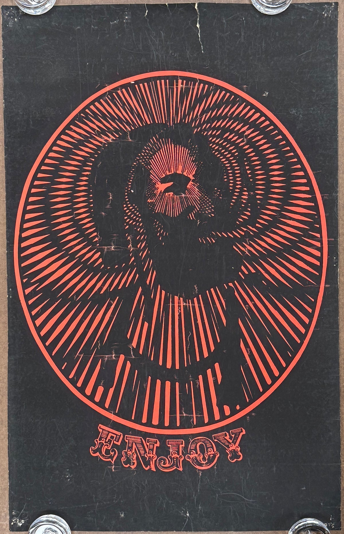 Black and red psychedelic graphic featuring The Zig-Zig man logo with the text ENJOY under the portrait. 