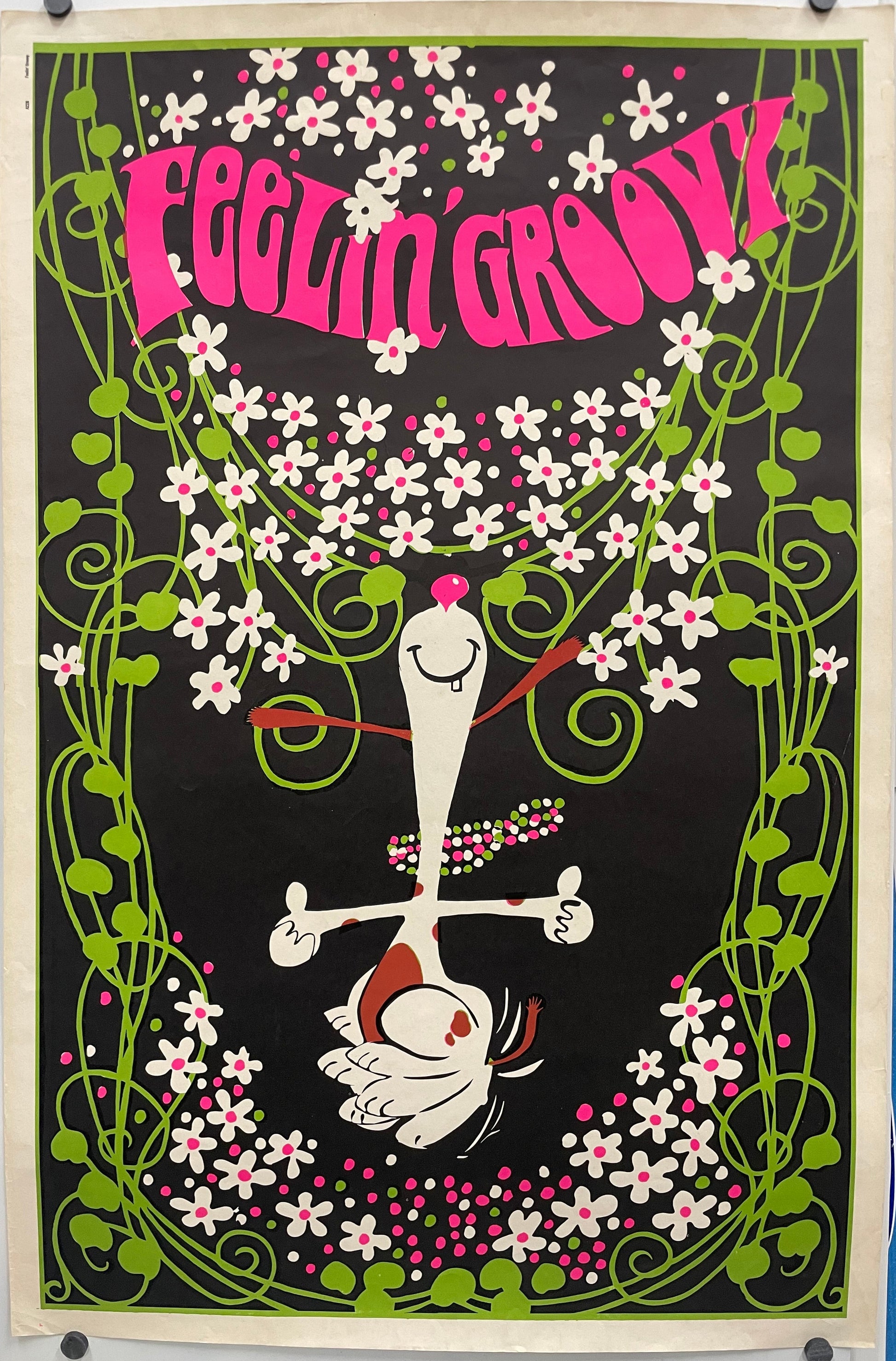 FEELIN' GROOVY ( title across the top) fun and lively vintage lithographic commercial poster. Image of a dancing Snoopy wearing a colorful beaded necklace, surrounded by flowers.