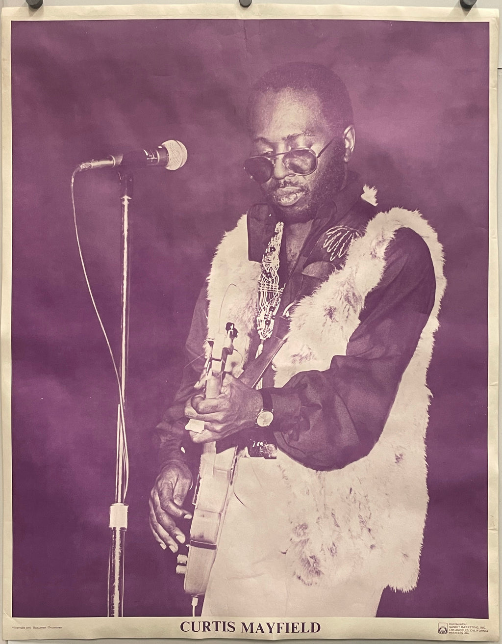 Vintage-style poster of musician, Curtis Mayfield, playing guitar with a microphone, on a purple background, 1971