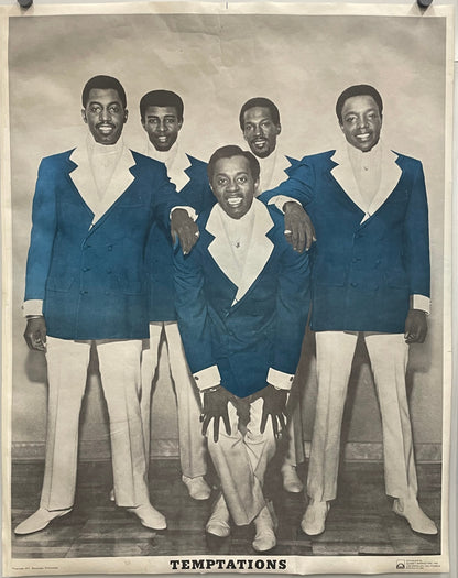 Vintage photograph of a group of men in suits with 'The Temptations' text, 1971
