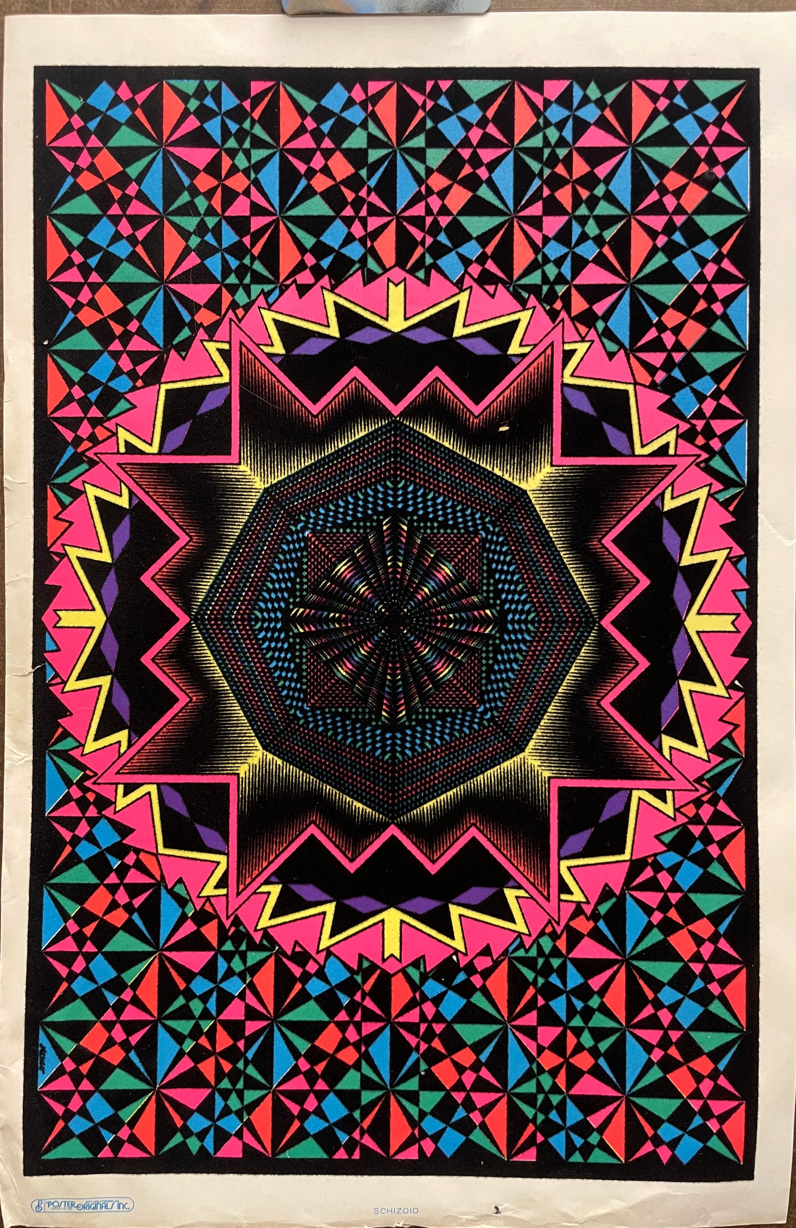 Bright fluorescent colors contrast with the velvet flocking that adds texture to this beautiful geometric design
