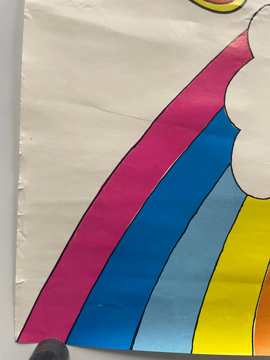 Detail of a colorful section of the poster with rainbow pattern on a white background.