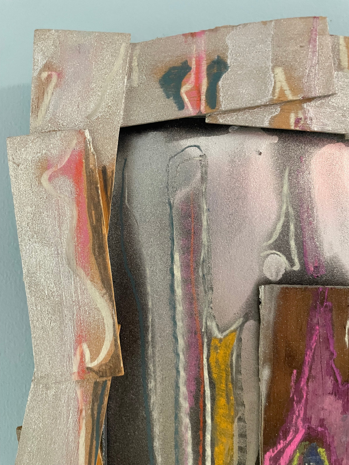 Abstract art piece with layered colors on a light blue background