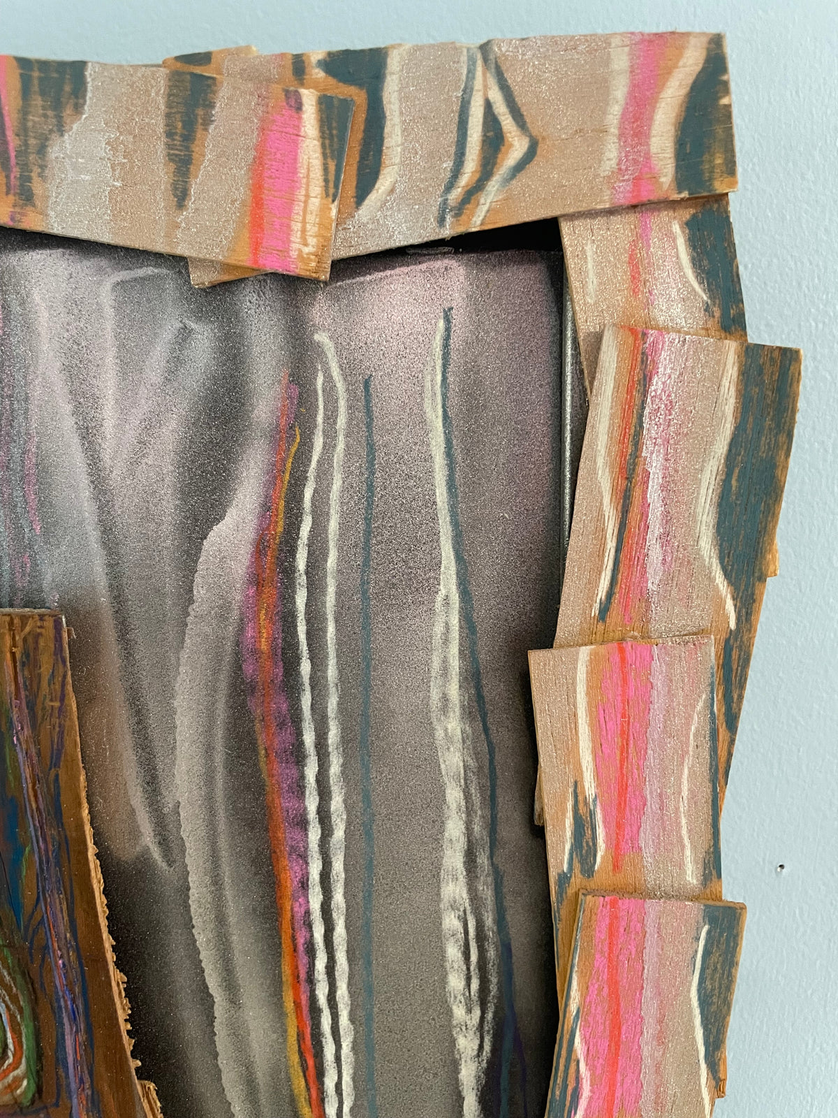 Abstract art piece with colorful geometric patterns on a light blue background