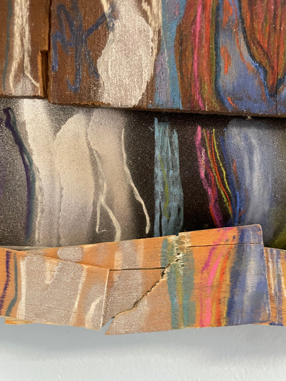 Close-up of a textured fabric with abstract patterns in earthy tones.