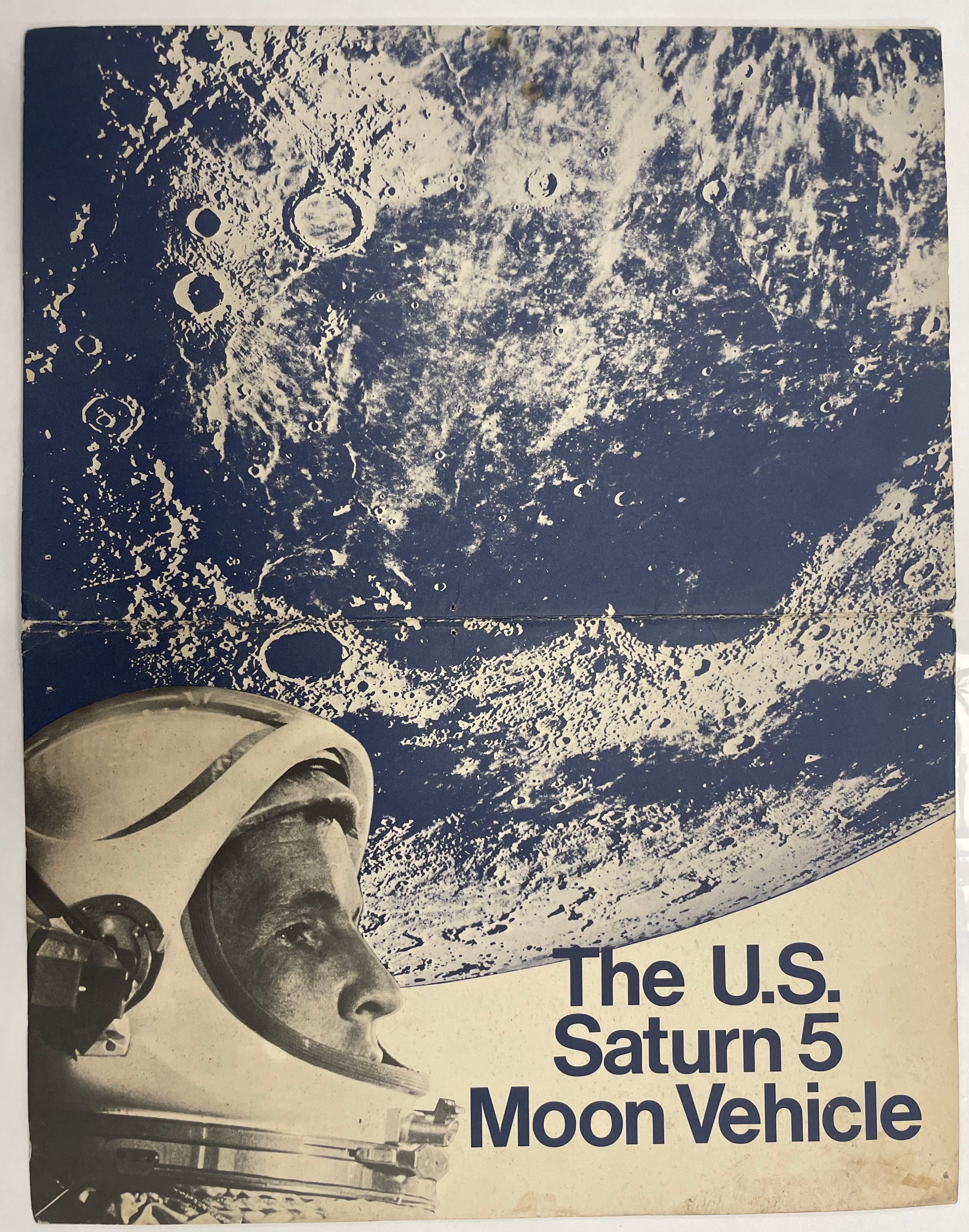 Promotional poster for U.S. Saturn 5 Moon Vehicle with astronaut helmet and lunar surface background