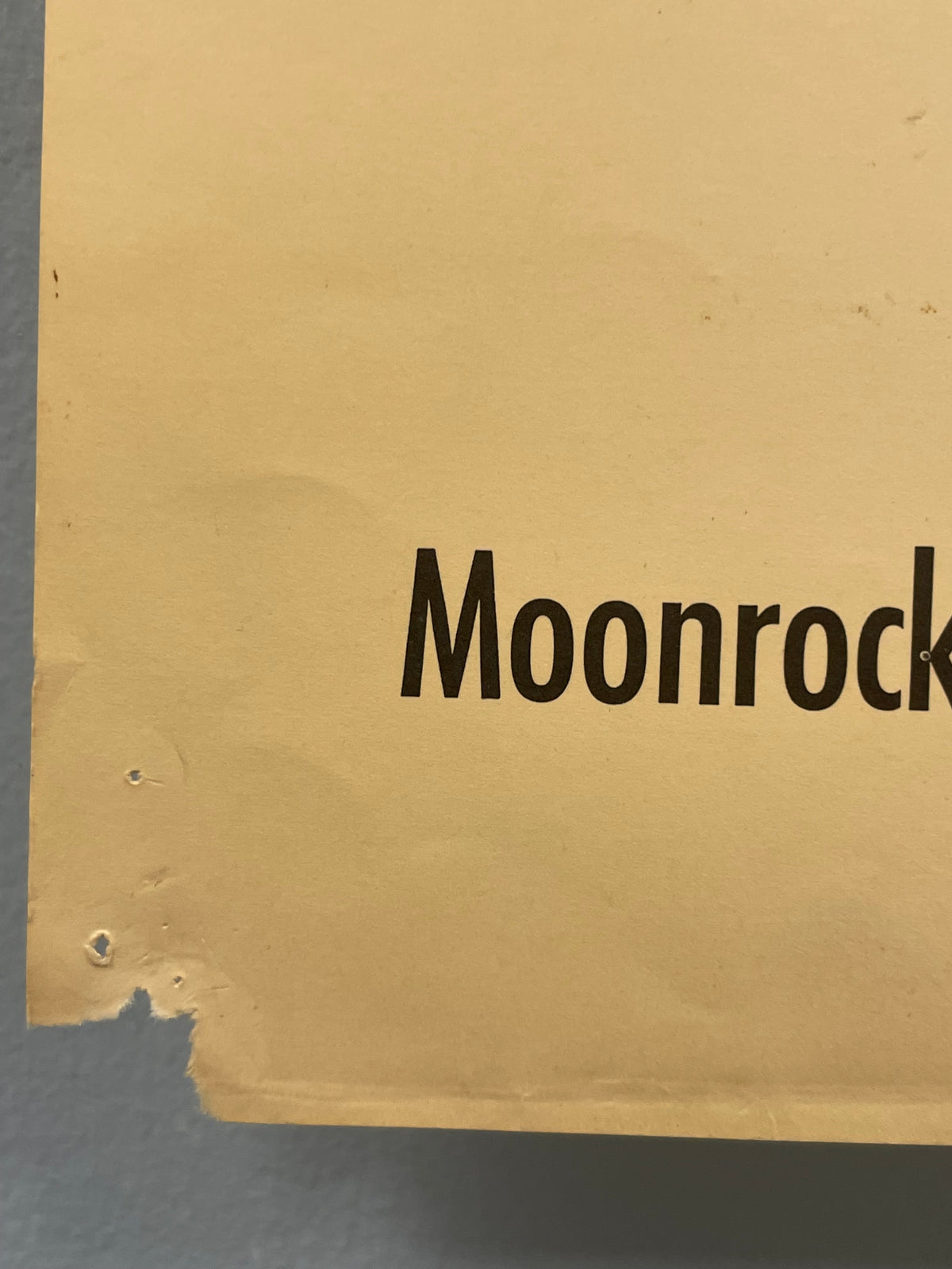 Cardboard box with 'Moonrock' branding on a gray background