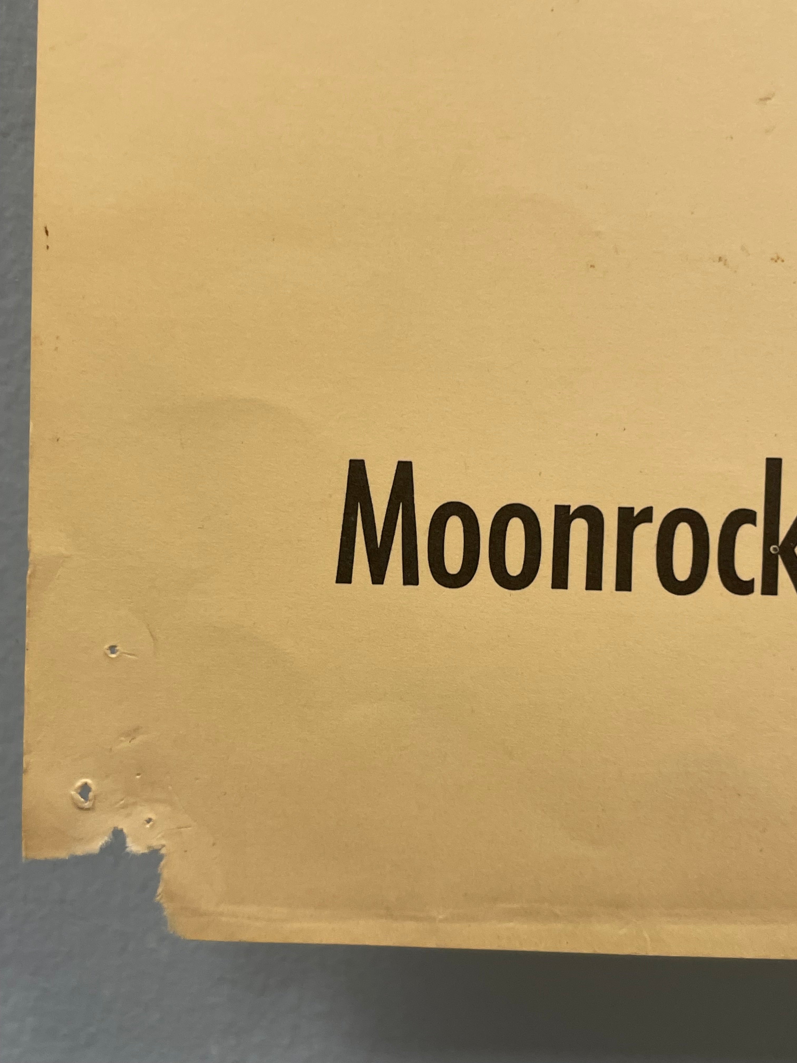 Cardboard box with 'Moonrock' branding on a gray background