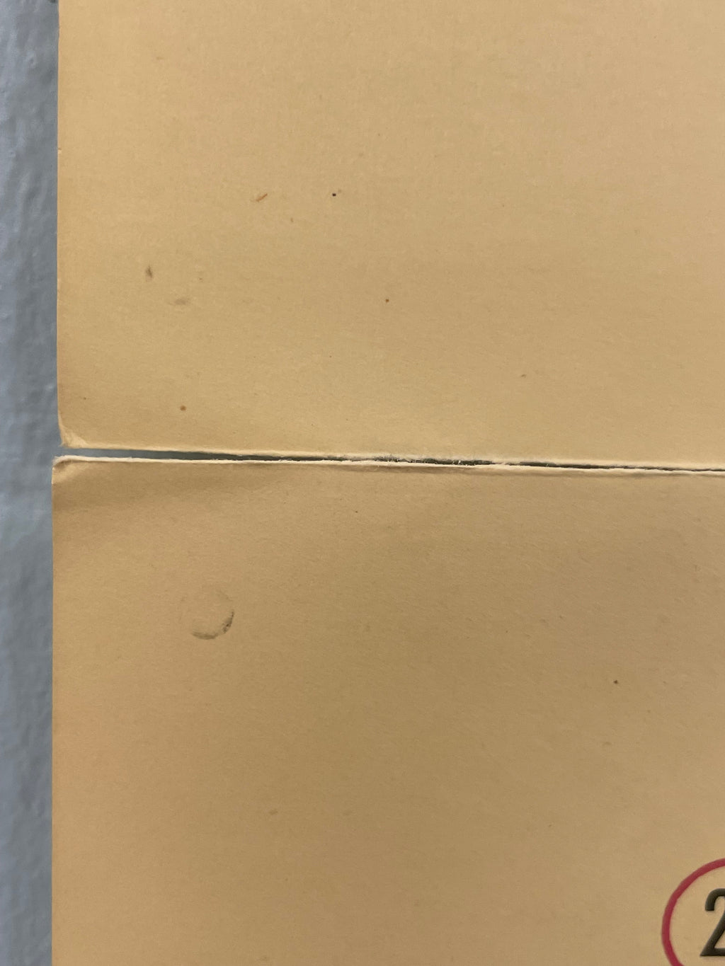 Close-up of a cardboard box corner with a visible seam.