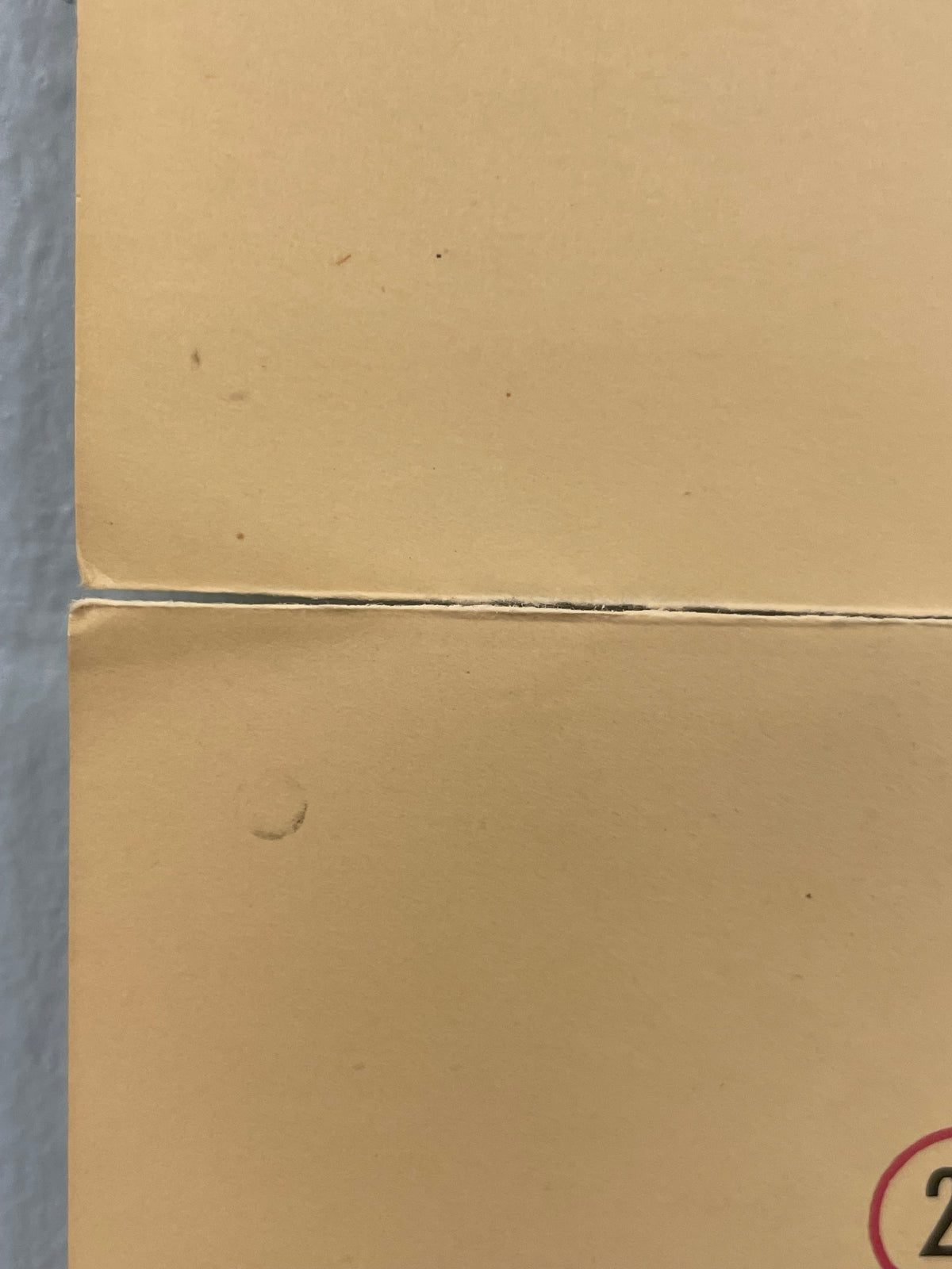 Close-up of a cardboard box corner with a visible seam.