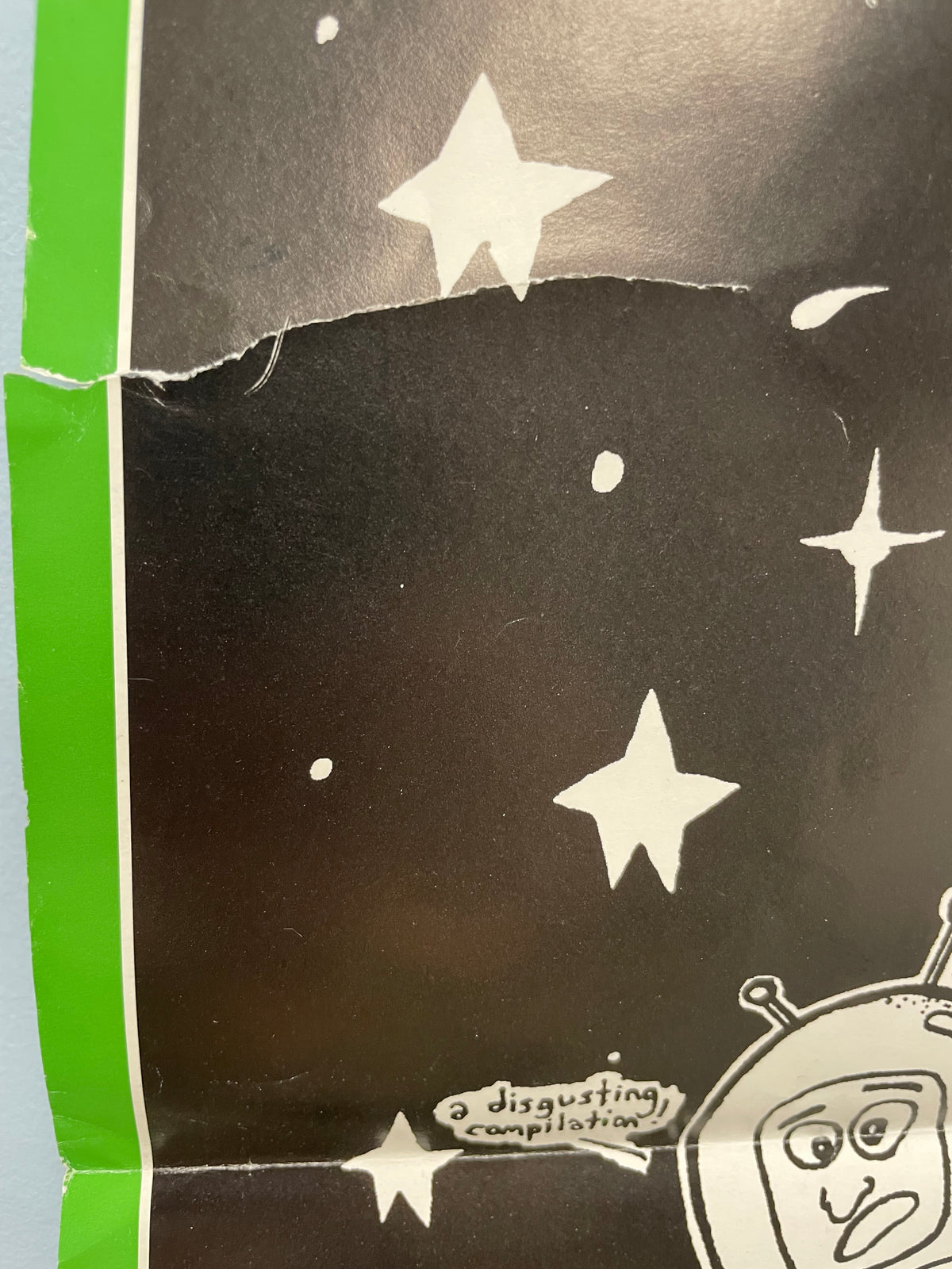 Black product with white star patterns on a green border