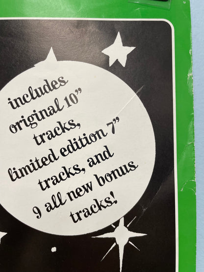 Label on a vinyl record with text about tracks and editions.