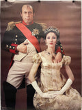 Man in historical military uniform and woman in formal gown with tiara against a brown background