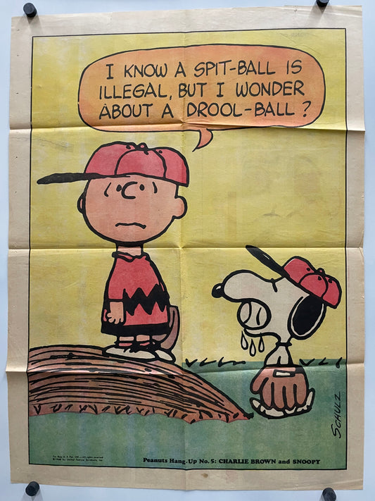 Comic strip featuring Charlie Brown and Snoopy with a humorous dialogue about spitballs and drool balls.