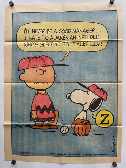 Comic strip featuring Snoopy and Woodstock with a baseball theme on a beige background.