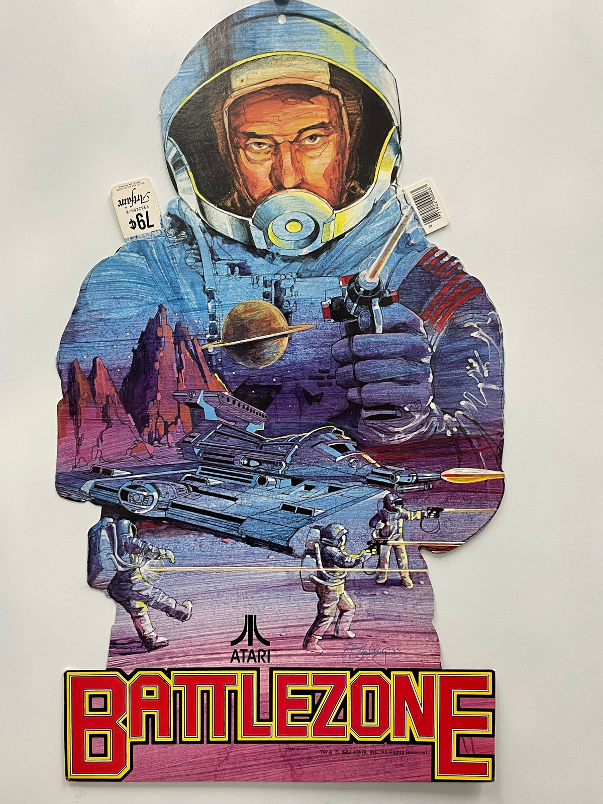 Cardboard cutout of an astronaut from the Atari Battlezone game, featuring the game's logo and title.