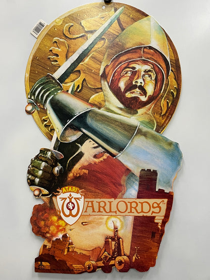 Decorative wall piece with a sword, helmet, and 'Atari Warlords' logo on a white background