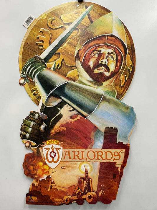 Decorative wall piece with a sword, helmet, and 'Atari Warlords' logo on a white background
