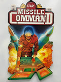 Vintage Atari Missile Command II game box with a character and rockets on a white background