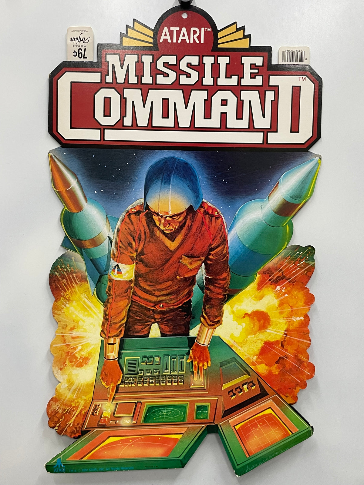 Vintage Atari Missile Command II game box with a character and rockets on a white background