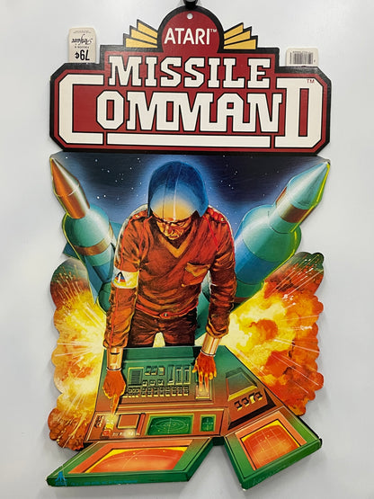 Vintage Atari Missile Command II game box with a character and rockets on a white background
