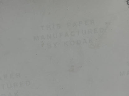 Off-white background with text 'THIS PAPER MANUFACTURED BY KODAK' 