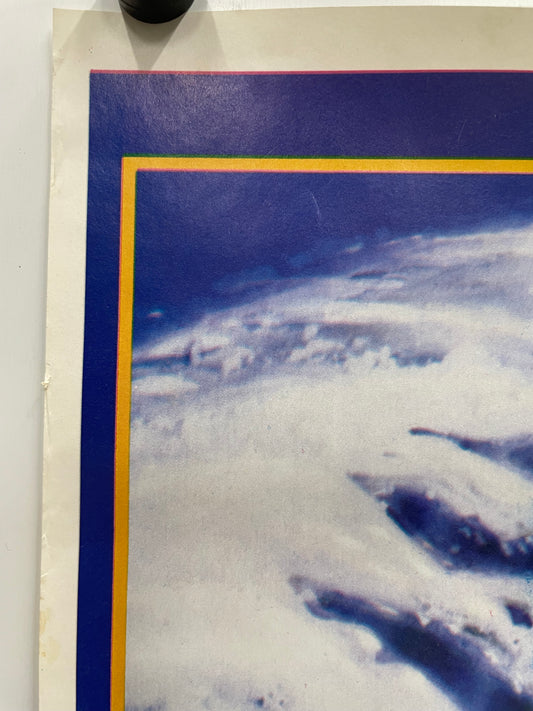 Poster of Earth from space with a blue border and yellow frame.