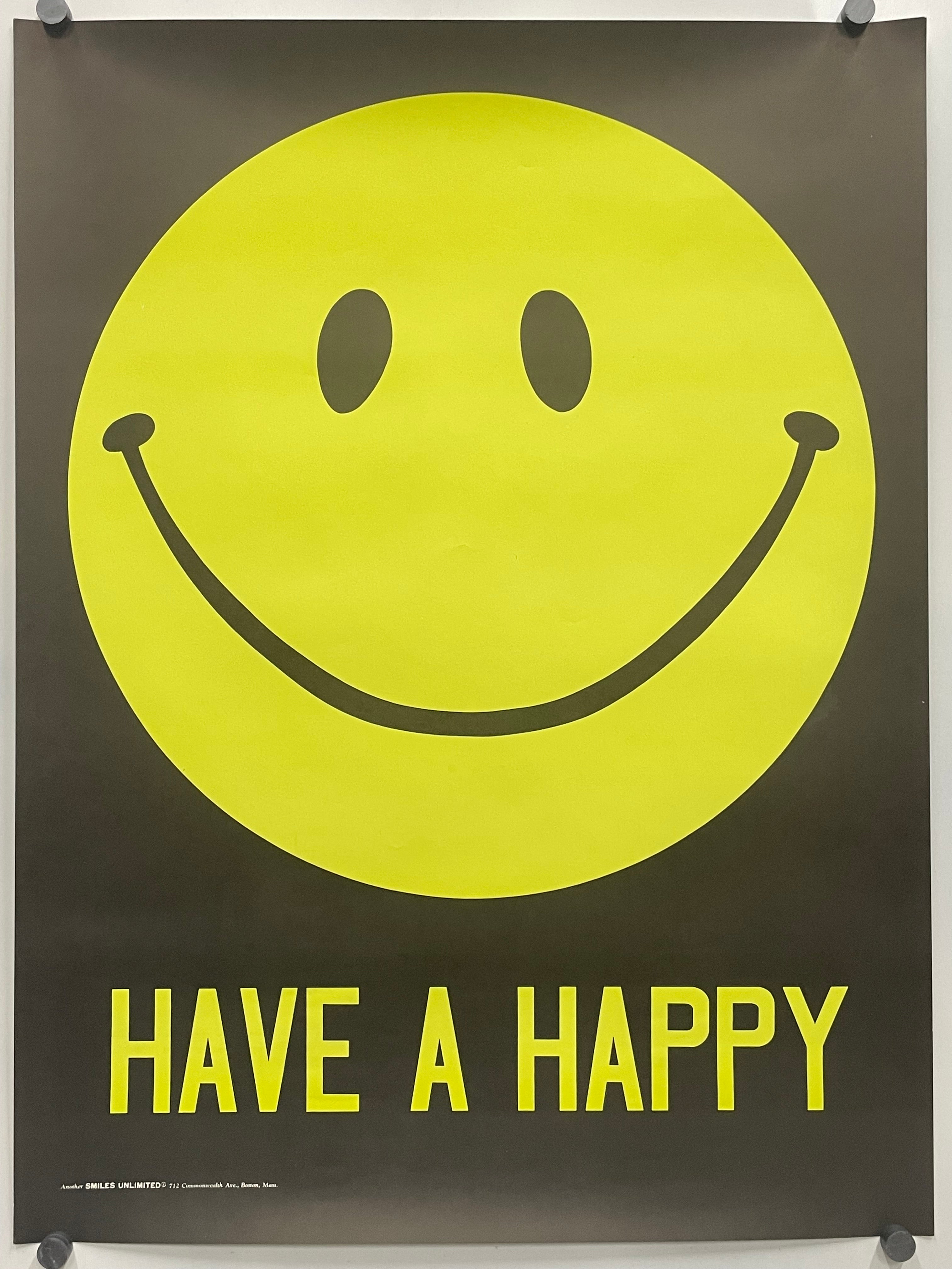 A black poster featuring a large yellow smiley face and the words 'HAVE A HAPPY' in yellow, hung with visible wall anchors.
