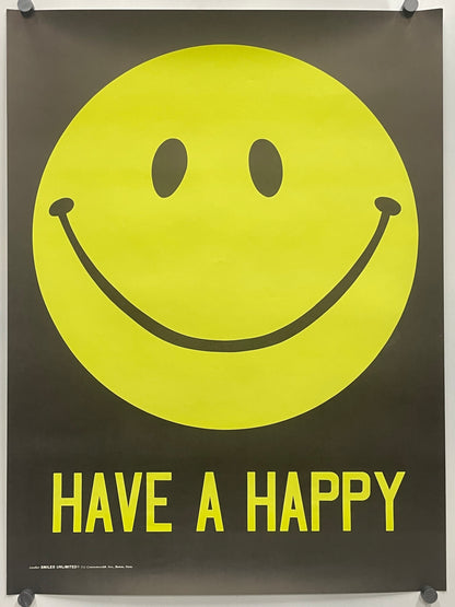 A black poster featuring a large yellow smiley face and the words 'HAVE A HAPPY' in yellow, hung with visible wall anchors.