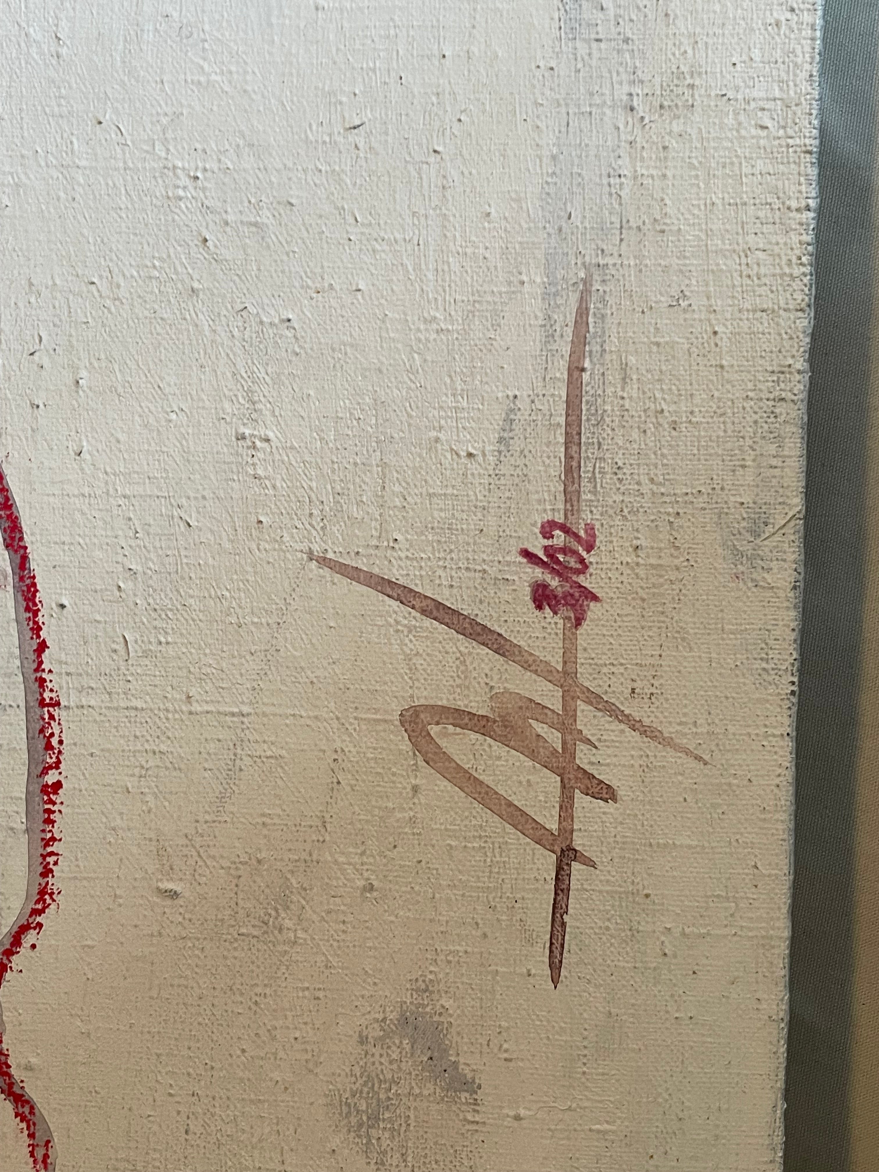 Close-up of a textured off-white canvas or wall with a reddish-brown signature and small red handwritten numbers near the center.