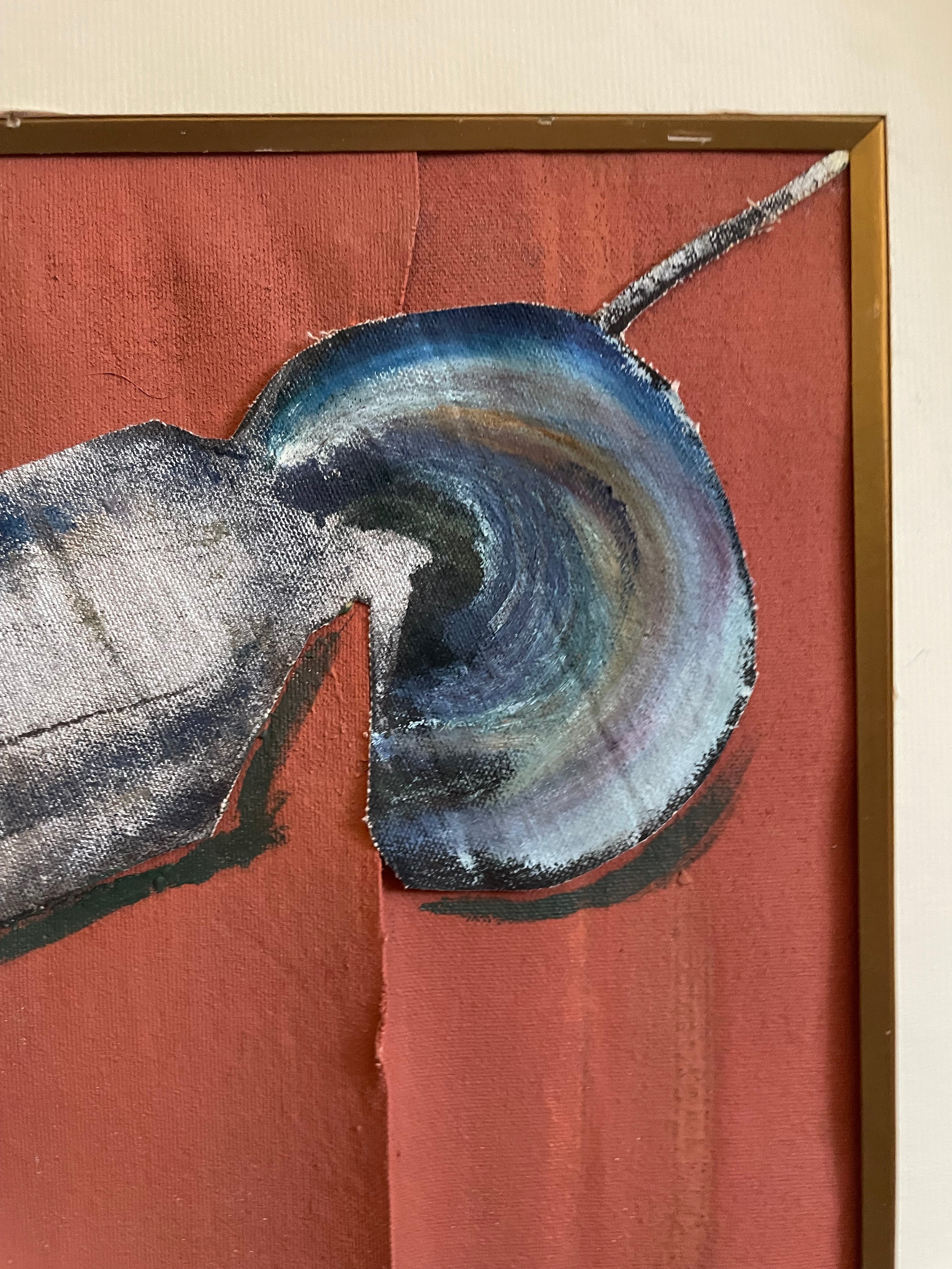Abstract framed artwork featuring a textured circular form in blue, gray, and white tones against a warm terracotta background, enclosed in a gold-toned frame.