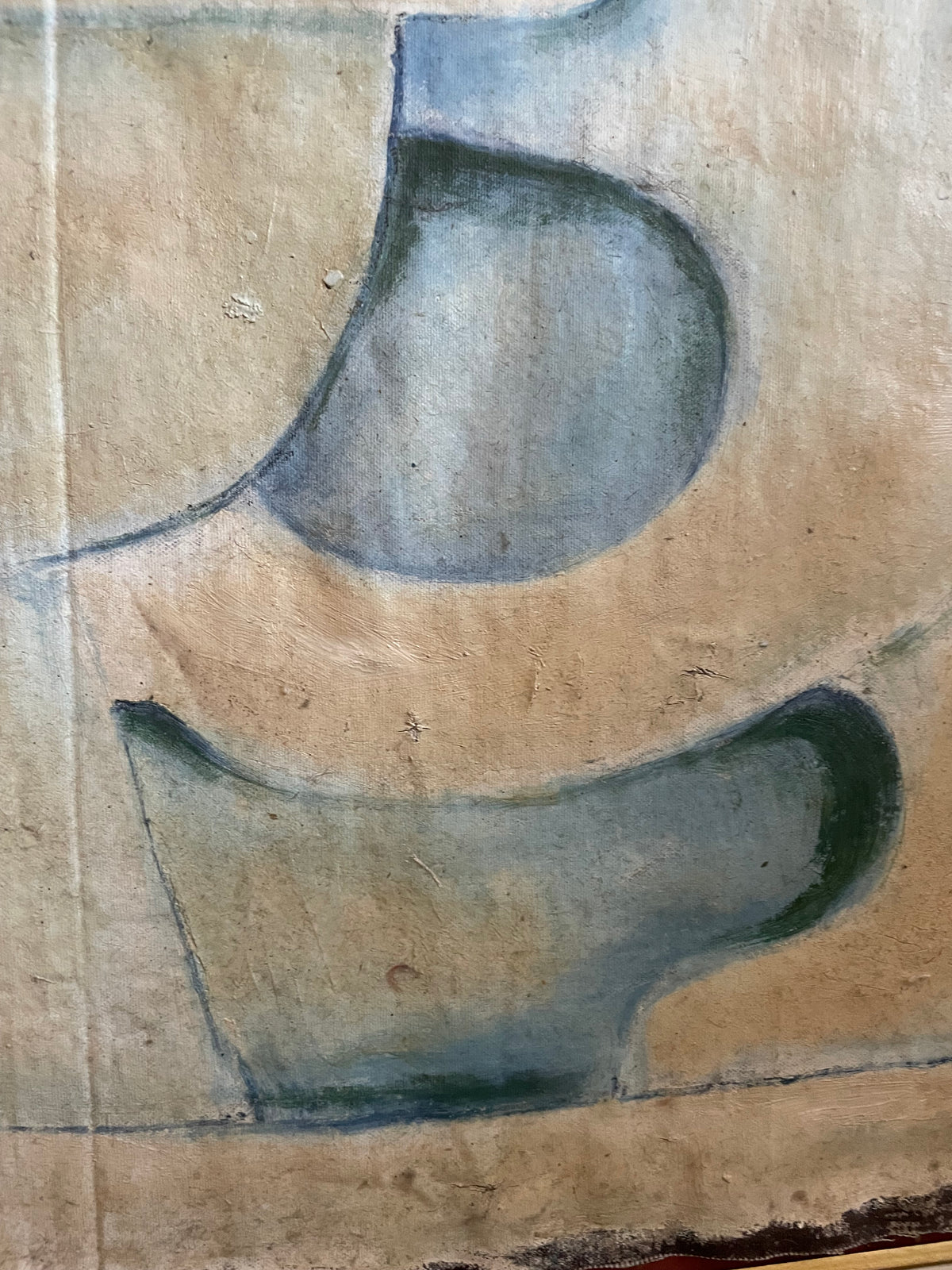 A close-up of a textured beige surface with dark gray painted abstract shapes, likely part of a canvas print or wall art.
