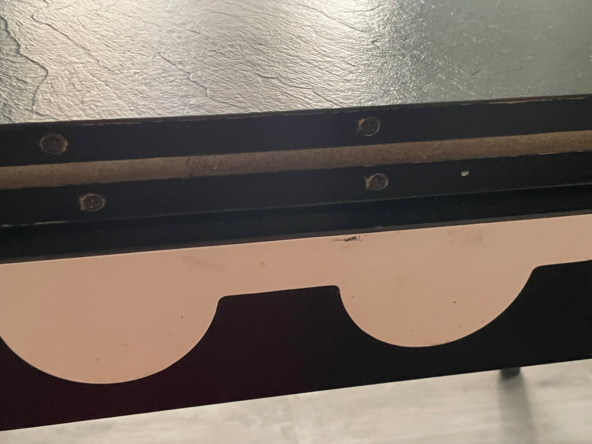 Close-up of scuffs on the scalloped panel.